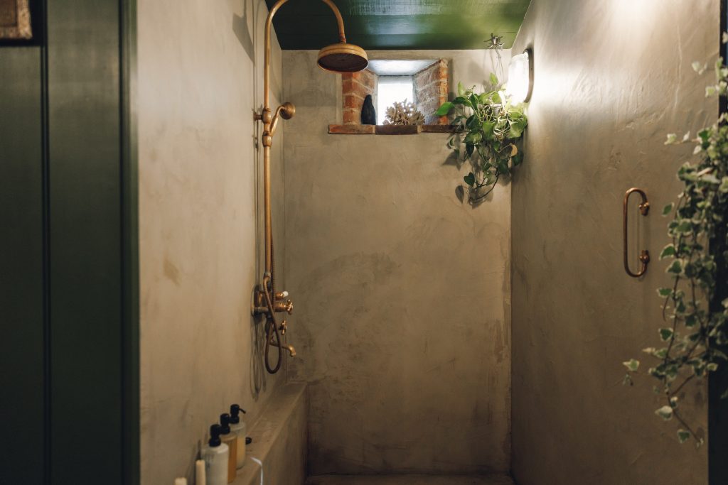 The walk-in shower with brass fittings