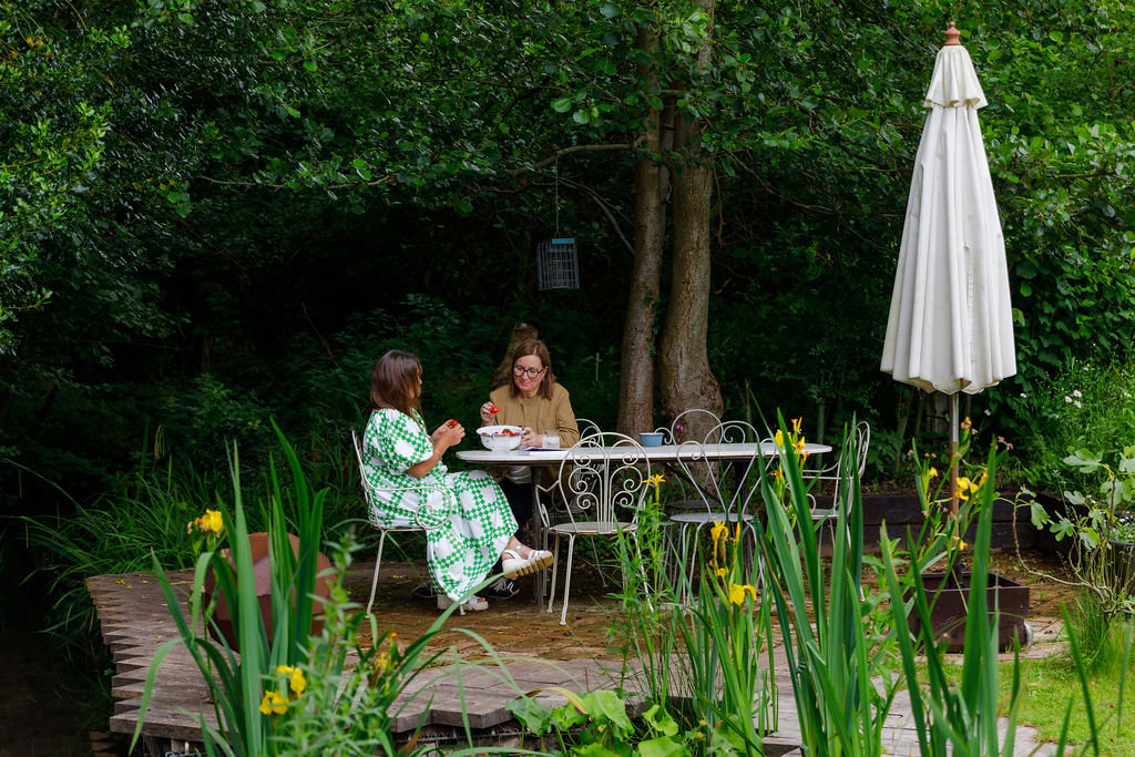 Lunch by the river under the parasol at Riverbank