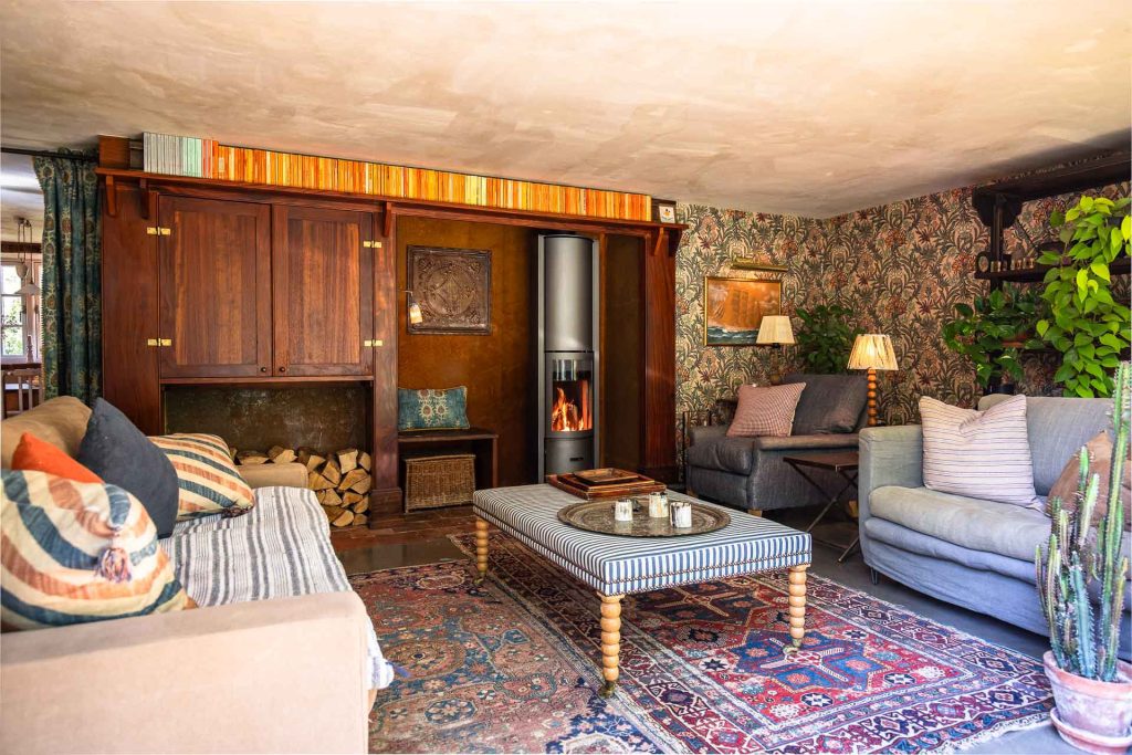 Riverbank's lounge with the wood burner lit