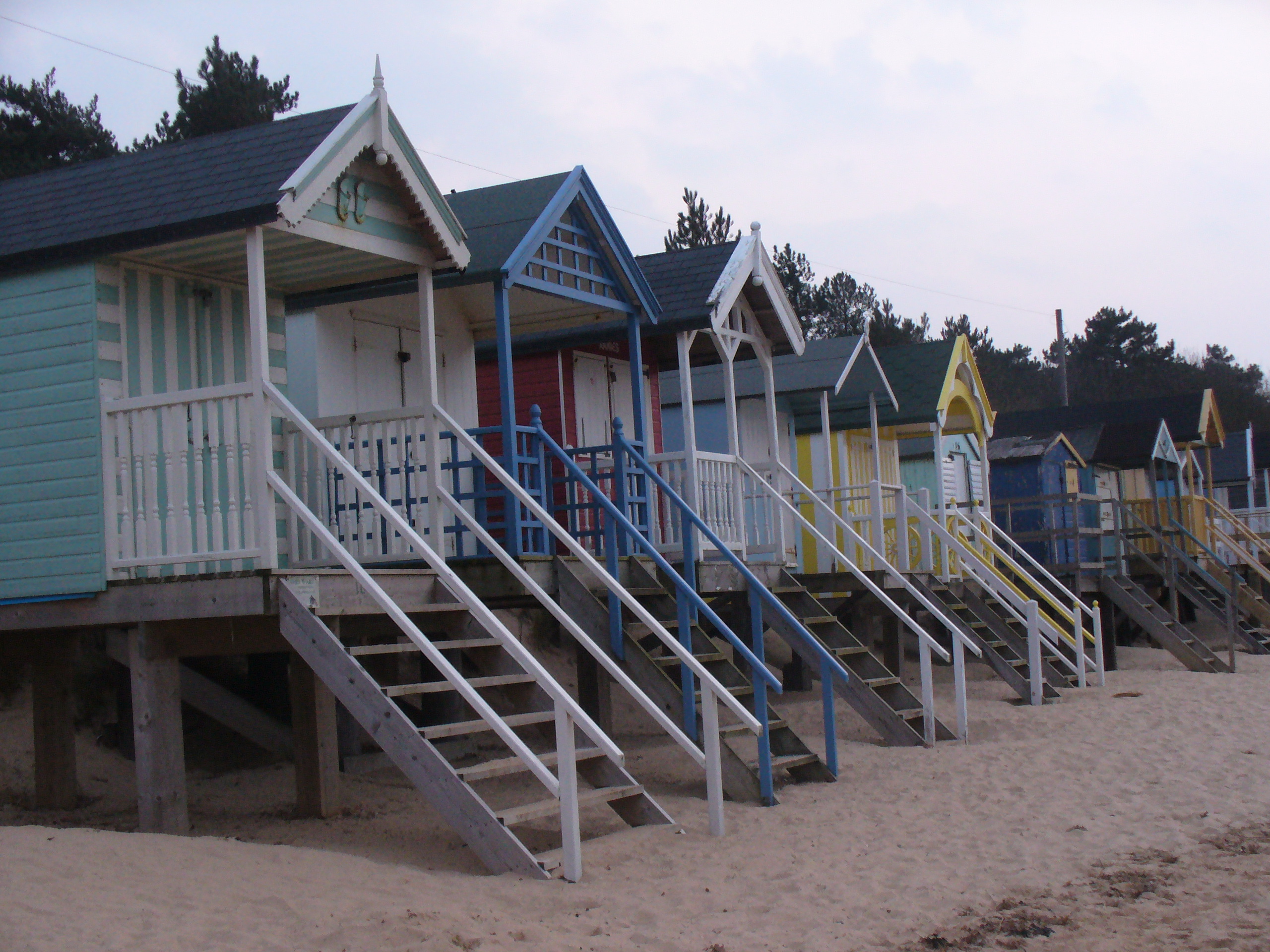 Painted beach huts on stilts at Wells-next-the-Sea
