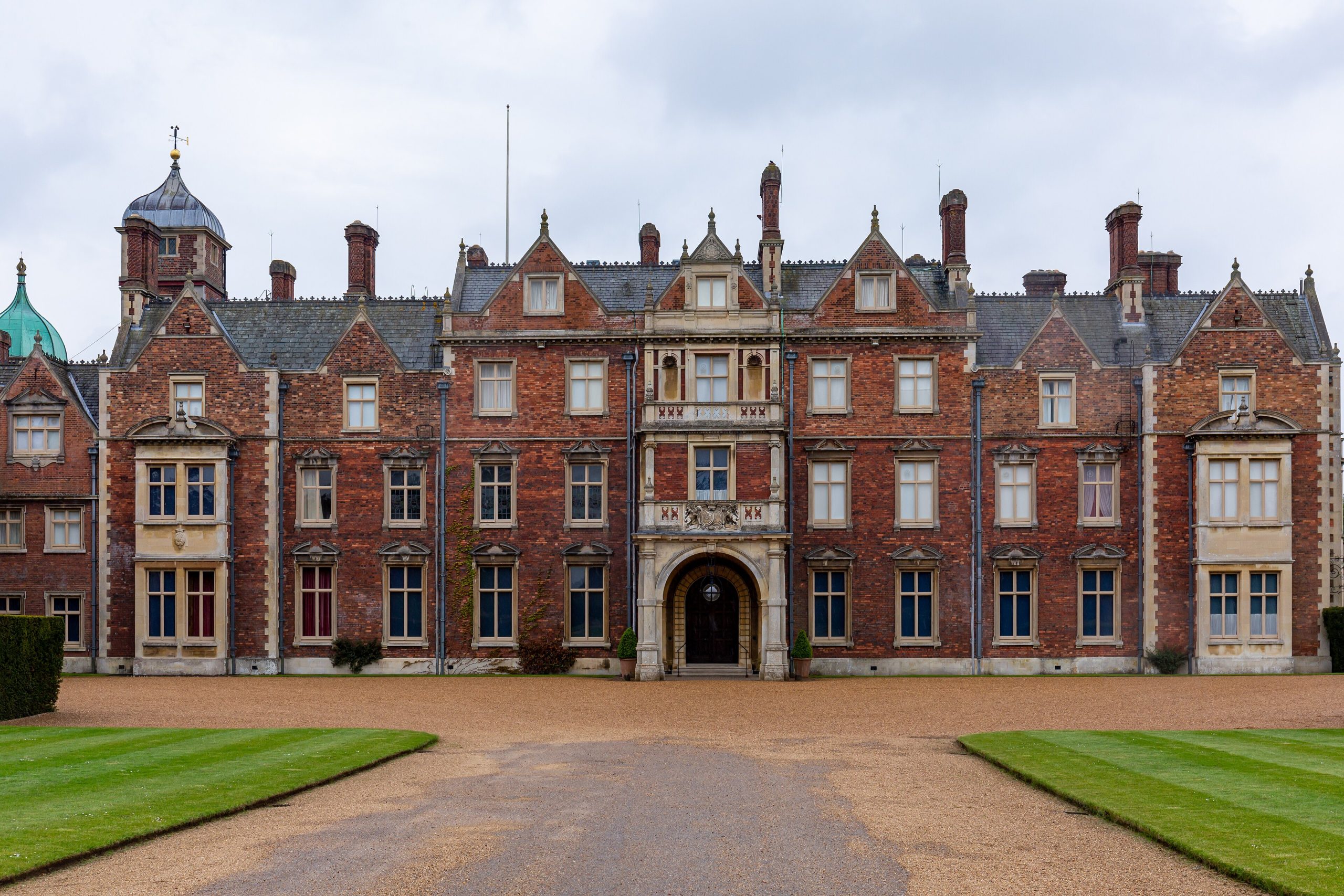 The front of Sandringham House across its lawn
